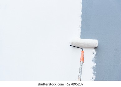 Roller Brush Painting, Worker painting on steel surface wall by the roller brush for protection and corrosion. - Shutterstock ID 627895289