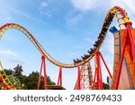 A roller coaster in action at an amusement park