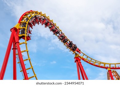 A roller coaster in action at an amusement park