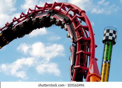 Roller coaster with clouds blue sky