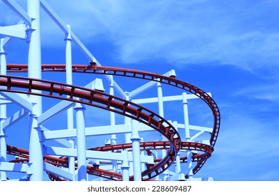 Roller coaster with clouds blue sky