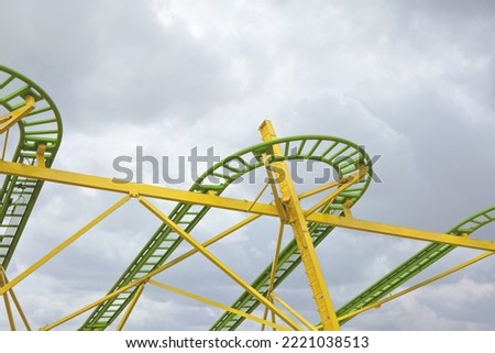 Roller coaster on cloudy sky backgroundnt