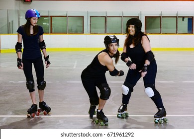 Roller Derby Girls Focus On Center Skater