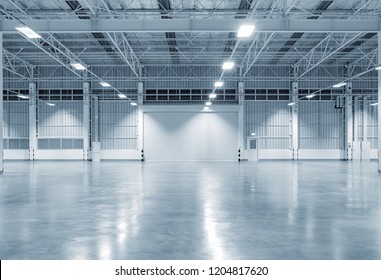 Roller door or roller shutter using for factory, warehouse or hangar. Industrial building interior consist of polished concrete floor and closed door for product display or industry background. - Shutterstock ID 1204817620