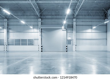 Roller door or roller shutter using for factory, warehouse or hangar. Industrial building interior consist of polished concrete floor and closed door for product display or industry background. - Shutterstock ID 1214918470