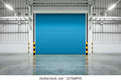 Roller Door Or Roller Shutter Using For Factory, Warehouse Or Hangar. Industrial Building Interior Consist Of Polished Concrete Floor And Closed Door For Product Display Or Industry Background.