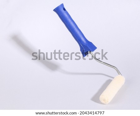 Roller hovering on a gray background. Minimal layout