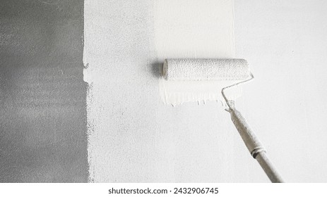 Roller paintbrush white color on concrete wall room interior  - Powered by Shutterstock