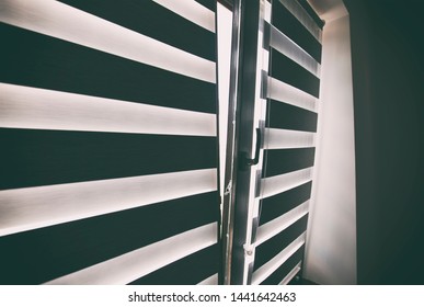 Roller Shutters On The Plastic Brown Window In The Living Room