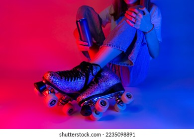 Roller skater holding a soda drink in a can during rest. Skating - sports and recreation. Saturated pink and blue, pop art style poster. - Shutterstock ID 2235098891