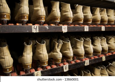 The Roller Skates Are All Lined Up Ready To Be Worn At The Roller Rink.