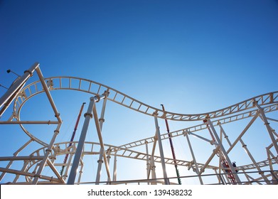 Roller-coaster with blue sky.