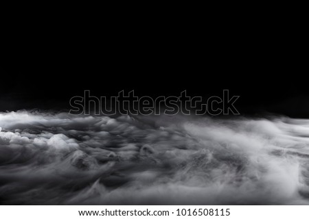 Rolling billows of swirling clouds from dry ice across the bottom even light