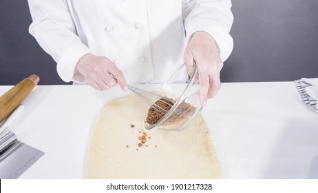 Rolling Dough With A French Rolling Pin To Bake Cinnamon Rolls.