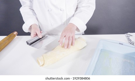 Rolling Dough With A French Rolling Pin To Bake Cinnamon Rolls.