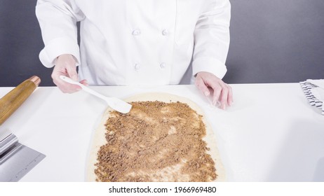 Rolling Dough With A French Rolling Pin To Bake Cinnamon Rolls.