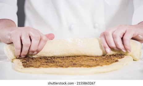 Rolling Dough With A French Rolling Pin To Bake Cinnamon Rolls.