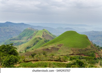Rolling fertile hills with fields and crops on Ring Road of Cameroon, Africa