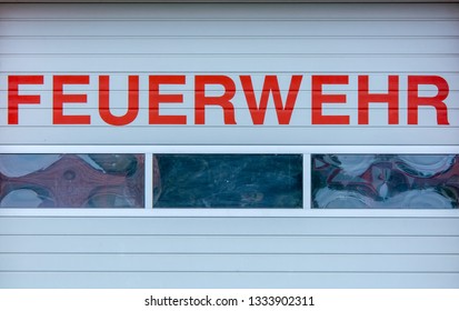 Rolling Gate Of A Fire Station With The Words 