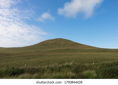 Rolling Green Hill, Grassy Hill, Blue Sky, Clouds And Fence