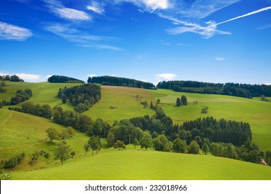 Rolling Green Hills Of Germany With Blue Sky