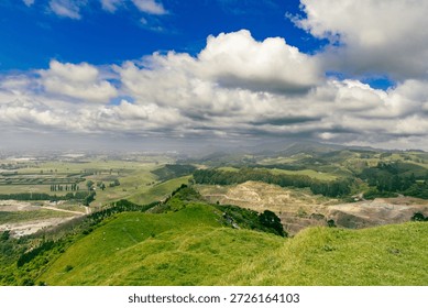 Rolling Green Hills Under Dramatic Cloudy Sky
