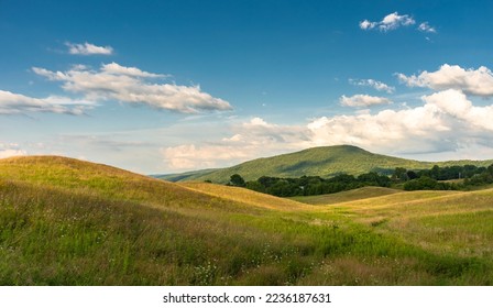 Rolling hills with clouds in the finger lakes of western New York - Shutterstock ID 2236187631