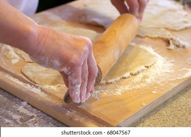 Rolling Out Cookie Dough On A Cutting Board