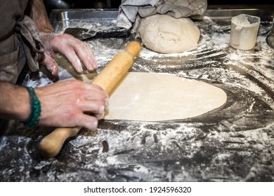 Rolling Out The Dough For Baking Bread