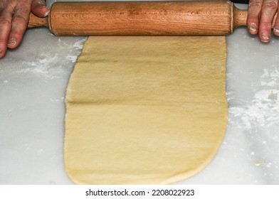 Rolling Out The Dough To Make Dumplings