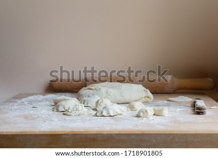 rolling pin for dough on a wooden table. home baking pies, pizza, pasta on the background of a wooden table. Concept of cooking at home