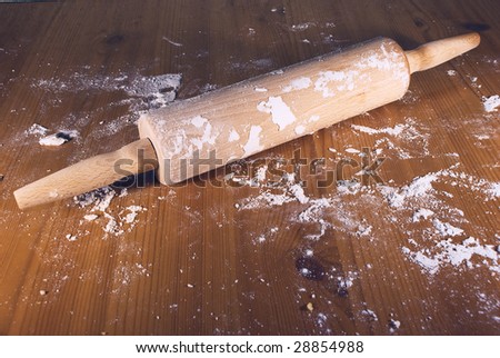 	 Rolling pin on the table with flour