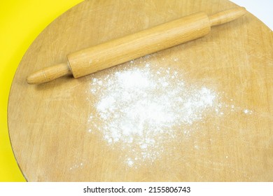 Rolling Pin On Traditional Circle Wooden Board, Top View Of Roller And Some Flour, Making Homemade Bread, Cooking Concept