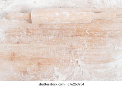 Rolling Pin On A Wooden Tray Covered With Flour 