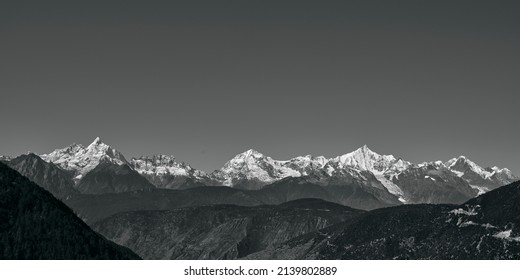 Rolling Snow Mountains Of Meili Range In Black And White