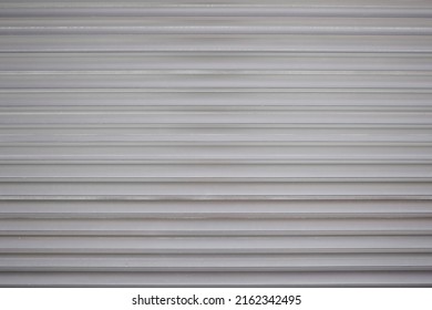 Rolling Steel Door Background. Metal Shop Shutter