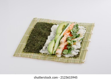 Rolling Sushi Maki On A Bamboo Mat