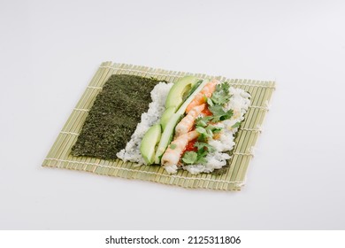 Rolling Sushi Maki On A Bamboo Mat