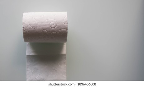 A Rolling Toilet Paper On White Background