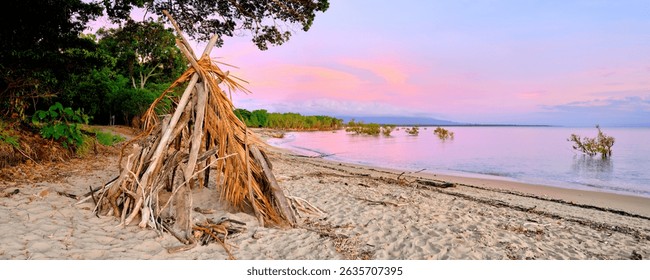 Rollingstone Beach sunset with Driftwood Teepee shelter