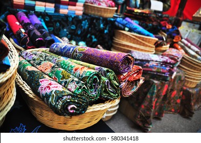 Rolls of Batik Fabric for sale in basket
