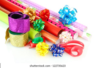 Rolls Of Christmas Wrapping Paper With Ribbons, Bows Isolated On White