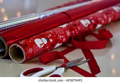 Rolls Of Christmas Wrapping Paper And Scissors                               