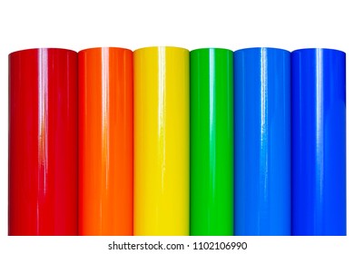 Rolls of colored vinyl film isolated on white background.