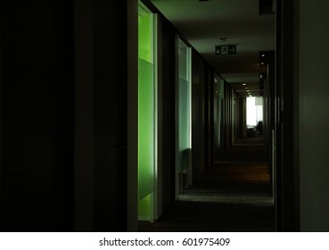 Rolls Of Empty Dark Office Hallway At Dawn