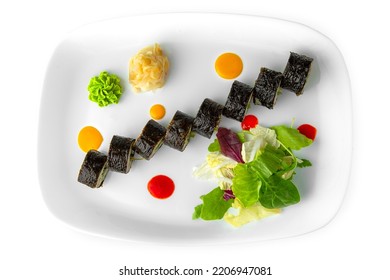 Rolls With Fish Paste And Chuka. Balanced, Nutritious, Tasty And Nutritious Food. Ready-made Menu For A Restaurant Or For Delivery. Dish In A White Plate Isolated On A White Background.