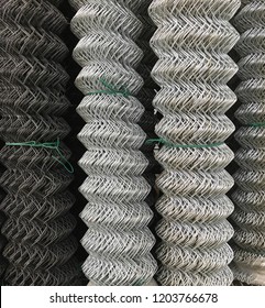 Rolls Of Galvanized And Coated Chain Link Fencing.