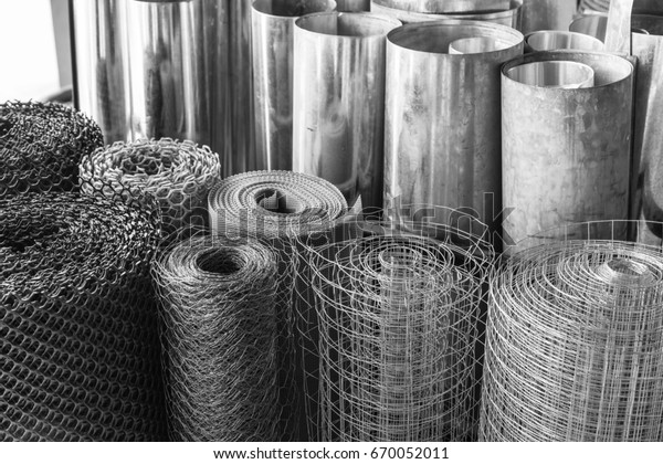 rolls\
of galvanized metal sheets, steel chicken wire mesh, and plastic\
wire mesh, material for making divider and\
screen