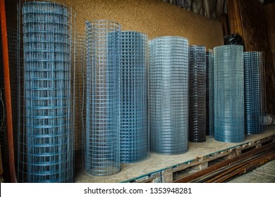 Rolls of iron mesh (wire mesh) use for reinforce concrete in construction site. Metal grid. Grid of pending orders. Metal mesh in rolls.