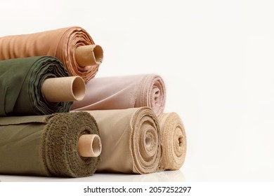 Rolls of pastel color fabric isolated on white - Shutterstock ID 2057252297